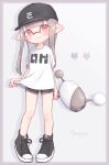 1girl bangs baseball_cap black_headwear black_shorts blunt_bangs blunt_ends border closed_mouth commentary cross-laced_footwear dolphin_shorts domino_mask eyebrows_visible_through_hair grey_border grey_hair hat highres holding holding_weapon inkling long_hair looking_at_viewer luna_blaster_(splatoon) mask no_socks pink_border pioxpioo pointy_ears print_headwear print_shirt red_eyes shadow shirt shirt_hold shoes short_shorts short_sleeves shorts smile sneakers solo splatoon_(series) splatoon_2 standing t-shirt tentacle_hair twitter_username weapon white_shirt 