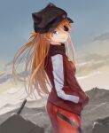  1girl ass bangs black_eyepatch black_headwear blue_eyes bodysuit breasts commentary_request cowboy_shot day eyepatch from_side hair_ornament highres jacket long_hair looking_at_viewer looking_to_the_side medium_breasts mountainous_horizon nanashi_(74_nanashi) neon_genesis_evangelion orange_hair outdoors pilot_suit plugsuit red_bodysuit red_jacket shikinami_asuka_langley solo souryuu_asuka_langley standing white_jacket 