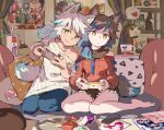  2girls animal_ears bare_shoulders barefoot brown_hair controller denim game_controller gamepad highres indoors looking_at_viewer multiple_girls original pillow seiza sitting smile sweater tail tennohi yellow_eyes 