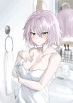  1girl ahoge bangs bathroom blush breasts cleavage collarbone eyebrows_visible_through_hair fate/grand_order fate_(series) hair_between_eyes hand_on_own_chest highres jeanne_d&#039;arc_(alter)_(fate) jeanne_d&#039;arc_(fate)_(all) kohaku_teru large_breasts looking_at_viewer mirror reflection short_hair silver_hair sink solo toothbrush towel tsurime upper_body wet yellow_eyes 