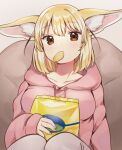  1girl animal_ear_fluff animal_ears bag bangs bean_bag_chair blonde_hair breasts brown_eyes chips collarbone commentary_request eating eyebrows_visible_through_hair fennec_(kemono_friends) food fox_ears gradient gradient_background grey_background highres holding holding_bag hood hoodie kemono_friends knees knees_up light_blush looking_at_viewer medium_breasts medium_hair mouth_hold pink_hoodie simple_background sitting solo suicchonsuisui upper_body 