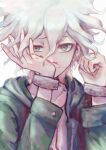  1boy a_po_(liuxiaobo0413) bangs blood blood_on_face collarbone cuffs danganronpa_(series) danganronpa_2:_goodbye_despair face green_jacket grey_background grey_hair hands_on_own_face hands_up hood hood_down hooded_jacket jacket komaeda_nagito long_sleeves looking_at_viewer male_focus nosebleed open_clothes open_jacket shackles shirt short_hair simple_background solo symbol_commentary upper_body white_hair white_shirt wiping_nose 