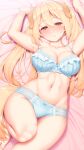  1girl animal_ears armpits arms_up bangs barefoot bed_sheet blonde_hair blue_bra blue_panties blush bow bow_panties bra breasts collarbone commentary_request dog_ears dog_girl eyebrows_visible_through_hair groin hair_between_eyes highres large_breasts long_hair looking_at_viewer lying navel on_back orange_eyes original panties smile solo stomach tachimi_(basue) twintails underwear underwear_only 