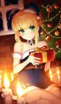  1girl ahoge artoria_pendragon_(all) bare_shoulders bell belt blonde_hair blue_bow blue_dress blue_headwear blush bow box braid candle candy candy_cane choker christmas christmas_tree closed_mouth commentary craft_essence dress fate/grand_order fate_(series) food french_braid gift gift_box green_eyes hair_bun hat holding holding_gift looking_at_viewer official_art present_for_my_master saber sakura_yuki_(clochette) santa_costume santa_hat short_dress short_hair sitting smile solo thighhighs wariza white_legwear white_neckwear window zettai_ryouiki 