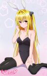  1girl alternate_costume animal_ears bare_arms black_leotard black_thighhighs blonde_hair blush breasts cleavage clenched_hand closed_mouth collarbone commentary curvy fake_animal_ears fingernails foot_out_of_frame gradient_background groin hair_between_eyes hair_intakes hand_on_own_thigh hand_up heart highleg highleg_leotard highres konjiki_no_yami leotard light_blue_background long_hair looking_at_viewer medium_breasts no_shoes playboy_bunny rabbit_ears red_eyes sidelocks signature simple_background sitting smile straight_hair strapless strapless_leotard thighhighs thighs to_love-ru tsurime two_side_up very_long_hair wariza yuyayomi 