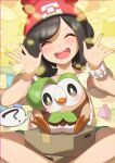  1girl ? absurdres bangs beanie blush brown_hair closed_eyes commentary_request cosplay dartrix dartrix_(cosplay) eyebrows_visible_through_hair eyelashes gen_7_pokemon green_shorts hands_up hat head_tilt highres medium_hair open_mouth pokemon pokemon_(creature) pokemon_(game) pokemon_sm red_headwear rowlet selene_(pokemon) shiny shiny_skin shirt short_sleeves shorts sitting smile spread_legs starter_pokemon t-shirt taisa_(lovemokunae) thought_bubble tongue upper_teeth yellow_shirt z-ring |d 