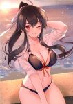  1girl alternate_costume arm_up beach bikini bikini_under_clothes black_bikini black_hair blush breasts cleavage collarbone commentary_request crop_top groin halterneck horizon ichinomiya_(blantte) kantai_collection large_breasts long_hair looking_at_viewer navel o-ring o-ring_bikini ocean one_eye_closed outdoors ponytail red_eyes ribbon shirt sitting smile solo sunset swimsuit swimsuit_under_clothes water yahagi_(kancolle) 