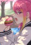  1girl blonde_hair burger dappled_sunlight earrings eyebrows_visible_through_hair food highres holding holding_food idolmaster idolmaster_million_live! jewelry lettuce long_sleeves looking_at_viewer maihama_ayumu multicolored_hair open_mouth outdoors pink_eyes pink_hair profile solo sunlight tomato tree tsurui two-tone_hair 