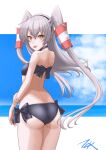  1girl amatsukaze_(kancolle) ass bikini black_bikini blue_sky brown_eyes cloud cowboy_shot from_behind hair_tubes highres horizon kantai_collection long_hair looking_at_viewer ocean side-tie_bikini silver_hair sky solo swimsuit t2r tongue tongue_out two_side_up windsock 