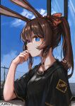  1girl amiya_(arknights) animal_ears arknights black_shirt blue_eyes brown_hair close-up cloud eyebrows_visible_through_hair from_side hand_on_own_face highres long_hair looking_at_viewer multicolored multicolored_eyes omuretu_(butterroru) ponytail red_eyes red_ribbon ribbon shirt sky solo t-shirt utility_pole 