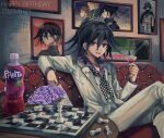  1boy :d bangs black_cape black_hair black_headwear cape checkered checkered_floor checkered_neckwear cocktail_glass collared_shirt commentary_request couch cup danganronpa_(series) danganronpa_10th_anniversary_costume danganronpa_v3:_killing_harmony dice_members_(danganronpa) drinking_glass eyebrows_visible_through_hair fanta flipped_hair flower grey_jacket grey_pants hair_between_eyes highres holding indoors jacket kozomezuki long_sleeves looking_at_viewer male_focus open_mouth ouma_kokichi pants purple_eyes purple_hair purple_shirt shirt sitting smile solo upper_teeth 