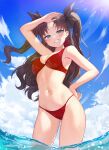  1girl absurdres arm_up armpits ass_visible_through_thighs bangs bare_arms bare_shoulders bikini blue_eyes blue_sky breasts brown_hair cleavage cowboy_shot day fate/stay_night fate_(series) grin hair_ribbon halter_top halterneck hand_on_hip highres long_hair looking_at_viewer medium_breasts navel outdoors parted_bangs pn_(wnsl216) red_bikini ribbon sky smile solo standing stomach string_bikini sunlight swimsuit thighs tohsaka_rin two_side_up wading water wavy_hair 