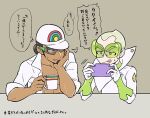  2boys :q baseball_cap blonde_hair bracer chacha_(ss_5087) closed_mouth coat collarbone commentary_request cup dark-skinned_male dark_skin faba_(pokemon) green-tinted_eyewear green_shirt handheld_game_console hands_up hat holding holding_cup holding_handheld_game_console kukui_(pokemon) logo looking_at_another male_focus mug multiple_boys open_clothes open_coat playing_games pokemon pokemon_(game) pokemon_sm shirt short_hair smile speech_bubble sunglasses sweatdrop table thought_bubble tongue tongue_out translation_request undershirt white_coat white_headwear 