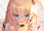  1girl akai_haato bangs blonde_hair blue_eyes blurry blurry_background blush commentary_request covering_mouth doll eyebrows_visible_through_hair eyes_visible_through_hair hair_between_eyes hair_ornament hair_ribbon hands_up heart heart_hair_ornament highres holding holding_doll hololive long_hair looking_at_viewer magowasabi nail_polish one_side_up red_nails red_ribbon ribbon shirt signature solo twitter_username virtual_youtuber white_shirt 