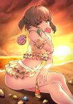  1girl antenna_hair beach bikini braid breasts brown_eyes brown_hair candy crossed_legs fingernails food french_braid hand_up highres holding holding_candy holding_food holding_lollipop lollipop looking_at_viewer medium_breasts mouth_hold navel santa_(sunflower) scrunchie seashell shell sitting smile solo sunset swimsuit tokyo_7th_sisters tsunomori_rona wrist_scrunchie yellow_bikini 