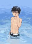 1boy bangs black_eyes black_hair chigusa_kasumi closed_mouth commentary_request cowboy_shot eyebrows_visible_through_hair hair_between_eyes hand_to_head hand_up highres looking_at_viewer looking_to_the_side male_swimwear ocean outdoors partially_submerged qualidea_code sekiya_asami shirtless short_hair solo standing swim_trunks swimsuit water wet 