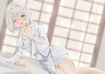  1girl 258n alternate_costume arm_support bangs blurry blurry_background blush breasts collarbone depth_of_field dutch_angle eyebrows_visible_through_hair green_eyes grey_robe hair_intakes hand_on_own_chin hand_up highres indoors konpaku_youmu looking_at_viewer lying medium_breasts no_headwear on_bed on_side one_eye_closed open_mouth raised_eyebrows short_hair silver_hair sitting sleepy sleeves_past_elbows solo touhou waking_up wide_sleeves yokozuwari 