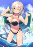  1girl bikini black_bikini blue_sky cloud commentary_request day green_eyes green_towel highres inflatable_toy inflatable_whale layered_bikini looking_at_viewer one_eye_closed orca original outdoors ryofuhiko short_hair silver_hair sky solo swimsuit water 