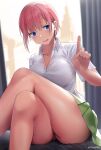  1girl absurdres artist_name bangs bed_sheet blue_eyes blush breasts breath cleavage collared_shirt crossed_legs curtains eyebrows_visible_through_hair go-toubun_no_hanayome green_skirt highres huge_filesize index_finger_raised large_breasts nakano_ichika nasenbi open_collar open_mouth pink_hair pixie_cut shirt short_hair short_sleeves sitting skirt solo sweat teeth thick_thighs thighs twitter_username white_shirt 