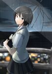  1girl amagami bangs black_hair blurry blurry_background brown_eyes city closed_mouth cloud cloudy_sky commentary cowboy_shot dress_shirt expressionless from_side highres holding holding_umbrella kibito_high_school_uniform looking_at_viewer looking_back nanasaki_ai night ocean railing rain school_uniform shirt short_hair short_sleeves sky solo transparent transparent_umbrella umbrella walking white_shirt yellow_sweater_vest ykh1028 