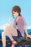  1girl alternate_costume brown_hair eyebrows_visible_through_hair fubuki_(kancolle) green_eyes grey_sweater grin highres hiroe_(cosmos_blue-02_421) kantai_collection looking_at_viewer low_ponytail sandals short_ponytail sidelocks signature sitting smile solo sweater swimsuit 