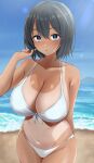  1girl absurdres arm_behind_back bangs bare_arms bare_shoulders beach bikini black_hair blue_eyes blush breasts cleavage collarbone crossed_bangs dark_skin eyebrows_visible_through_hair highres hotate-chan large_breasts looking_at_viewer mole mole_under_mouth navel ocean one-piece_tan original outdoors parted_lips short_hair swimsuit tan tanlines water white_bikini 