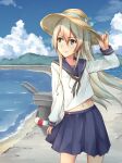  1girl alternate_costume anatamo beach blonde_hair blue_sailor_collar blue_skirt blue_sky cloud cowboy_shot day facing_viewer grey_eyes hand_on_headwear hat highres kantai_collection long_hair looking_to_the_side outdoors pleated_skirt rensouhou-chan sailor_collar school_uniform serafuku shimakaze_(kancolle) skirt sky solo sun_hat 