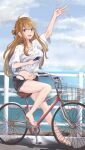  1girl absurdres ahoge bangs bicycle blue_eyes breasts brown_hair cellphone earrings full_body ground_vehicle highres holding holding_phone idolmaster idolmaster_million_live! izuminnu jewelry legs long_hair looking_at_viewer medium_breasts midriff nail_polish navel necklace ocean open_mouth phone riding_bicycle road sandals shirt sketch smartphone smile solo swept_bangs swimsuit swimsuit_under_clothes tied_shirt toenail_polish toenails tokoro_megumi waving white_shirt 