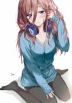  1girl bangs black_legwear blue_cardigan blue_eyes blush breasts brown_hair cardigan cleavage closed_mouth commentary_request eyebrows_visible_through_hair go-toubun_no_hanayome hair_between_eyes hand_up headphones headphones_around_neck highres long_hair long_sleeves looking_at_viewer medium_breasts nakano_miku no_shoes pantyhose saya_(mychristian2) shadow sitting sleeves_past_wrists solo very_long_hair wariza white_background 