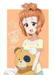  1girl bandages bear_hair_ornament boko_(girls_und_panzer) border brown_eyes brown_hair casual character_name commentary_request derivative_work girls_und_panzer hair_ornament hair_tie hair_up heart holding holding_stuffed_toy kayabakoro looking_at_viewer nishizumi_miho open_mouth orange_background outside_border shirt short_hair short_sleeves smile solo standing stuffed_animal stuffed_toy t-shirt teddy_bear tied_hair white_border yellow_shirt 