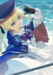  1girl artoria_pendragon_(caster)_(fate) artoria_pendragon_(fate) bangs beach belt beret black_gloves blonde_hair blue_cape blue_headwear blush breasts buttons cape double-breasted dress fate/grand_order fate_(series) feixiang_de_huojiren gloves green_eyes hat holding holding_staff hood hooded_cape long_hair long_sleeves looking_at_viewer multicolored multicolored_cape multicolored_clothes open_mouth red_cape shore small_breasts smile solo staff twintails white_dress 