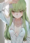  1girl bangs breasts buttons c.c. cleavage code_geass collarbone creayus eyebrows_visible_through_hair green_hair hand_up long_hair long_sleeves looking_at_viewer medium_breasts shirt solo upper_body white_shirt yellow_eyes 