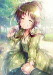  1girl blurry brown_hair camera closed_eyes depth_of_field hair_bun highres holding holding_camera holding_hands idolmaster idolmaster_cinderella_girls jewelry lens_flare light_rays long_hair ment necklace park pov producer_(idolmaster) solo sparkle takamori_aiko tied_hair tree 