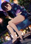  1girl ass bangs bare_legs barefoot bench blue_kimono blurry blurry_background blush brown_hair clothes_lift commentary dusk dutch_angle festival floral_print flower foliage hair_flower hair_ornament hand_fan hand_on_own_leg holding holding_fan japanese_clothes kamizaki_hibana kimono kimono_lift lantern legs looking_at_viewer original paper_fan paper_lantern parted_lips purple_eyes purple_flower railing sandals shiny shiny_skin short_twintails solo thighs toe_scrunch toes tree twintails uchiwa wooden_floor yukata zouri 