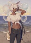  1girl animal_ears arm_up balloon beach blue_eyes body_markings bracelet caenis_(fate) casual chain_belt cloud conch cowboy_shot dark-skinned_female dark_skin denim eyebrows_visible_through_hair fate/grand_order fate_(series) footprints front-tie_top hand_on_own_head highres jeans jewelry looking_at_viewer navel necklace ocean pants purple_sky sand semi_finalfight shell water white_hair 