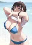  1girl beach bikini blue_bikini blue_eyes breasts brown_hair jonsun large_breasts looking_at_viewer mole mole_under_eye navel ocean original outdoors short_hair solo swimsuit tamami_(jonsun) thick_eyebrows twitter_username undressing wet wet_hair 