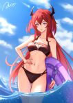 1girl absurdres arknights bangs bare_arms bare_shoulders bikini black_bikini blue_sky breasts cloud collarbone commentary cowboy_shot day hair_between_eyes halterneck hand_on_hip highres horns innertube long_hair looking_at_viewer medium_breasts navel parted_lips purple_eyes red_hair sky smile solo standing stomach surtr_(arknights) swimsuit thighs very_long_hair wading water yunjiang_zhanzhaji 