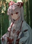  1girl :/ arm_at_side arm_up artist_name baggy_pants bamboo bamboo_forest bangs blunt_bangs breasts buckle closed_mouth collared_shirt commentary day eyebrows_visible_through_hair eyelashes forest fujiwara_no_mokou hair_ribbon hand_in_pocket highres koto_(shiberia39) leaf long_hair long_sleeves looking_at_viewer medium_breasts nature ofuda ofuda_on_clothes outdoors pants red_eyes red_pants ribbon serious shirt sidelocks silver_hair solo standing suspenders touhou tress_ribbon two-tone_bow upper_body white_shirt wing_collar 