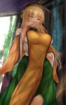  1girl blonde_hair breasts brown_headwear commentary_request dress green_skirt hat hidden_star_in_four_seasons highres long_hair matara_okina shounen_(hogehoge) skirt tabard touhou yellow_eyes 