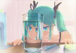  1girl absurdres aqua_eyes aqua_hair backlighting bare_shoulders book chromatic_aberration collarbone commentary cup drinking_glass hair_ribbon hatsune_miku highres indoors looking_at_viewer meltymap paper pen refraction ribbon smile solo spaghetti_strap table twintails upper_body v-shaped_eyebrows vocaloid water window 