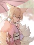  1girl absurdres animal_ears arknights bangs blonde_hair blurry blurry_background braid closed_mouth commentary cotton_candy depth_of_field eyebrows_visible_through_hair food fox_ears fox_girl fox_tail from_side green_eyes hair_between_eyes hair_rings hairband highres holding holding_food japanese_clothes kimono kyuubi long_sleeves looking_at_viewer looking_to_the_side multiple_tails obi oil-paper_umbrella pink_hairband pink_kimono red_(aba02) red_umbrella sash sleeves_past_wrists smile solo suzuran_(arknights) tail twin_braids umbrella wide_sleeves 