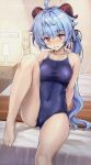  1girl ahoge alternate_costume arm_support bangs bare_arms bare_shoulders barefoot blue_hair blue_swimsuit blush breasts collarbone commentary competition_school_swimsuit covered_navel ganyu_(genshin_impact) genshin_impact goat_horns highres horns indoors knee_up kotatsu_(kotatsu358) large_breasts long_hair looking_at_viewer on_bed one-piece_swimsuit purple_eyes school_swimsuit sitting solo swimsuit twintails 