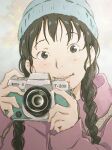  1girl bangs beanie blue_headwear blush braid brown_eyes brown_hair camera coat commentary grey_background hat head_tilt highres holding holding_camera knit_hat lips long_hair looking_at_viewer monodevil original purple_coat smile solo taking_picture twin_braids upper_body 