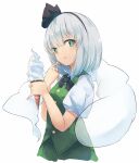  1girl :q arm_up bangs black_hairband black_neckwear black_ribbon blush bob_cut buttons collared_shirt eyebrows_visible_through_hair fen_zuo food food_on_face green_eyes green_skirt green_vest hairband hitodama holding ice_cream konpaku_youmu konpaku_youmu_(ghost) puffy_short_sleeves puffy_sleeves ribbon shirt short_hair short_sleeves silver_hair simple_background skirt solo standing symbol-only_commentary tongue tongue_out touhou upper_body vest white_background white_shirt wing_collar 