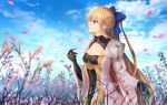  1girl ahoge anonamos artist_name artoria_pendragon_(caster)_(fate) artoria_pendragon_(fate) blonde_hair blue_bow blue_sky bow breasts check_commentary cherry_blossoms cleavage cloud commentary_request cowboy_shot eyebrows_visible_through_hair fate/grand_order fate_(series) field flower flower_field from_side gloves green_eyes juliet_sleeves long_hair long_sleeves medium_breasts petals puffy_sleeves sky smile solo twitter_username very_long_hair 