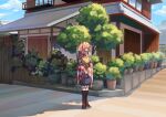  1girl absurdres apron bell character_name checkered checkered_kimono clothes_writing commentary_request frogsnake hair_bell hair_bobbles hair_ornament highres house japanese_clothes kimono motoori_kosuzu orange_hair outdoors plant potted_plant red_eyes solo standing touhou tree twintails 