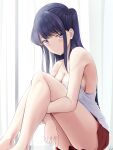  1girl black_hair blue_eyes blush breasts camisole cleavage closed_mouth commentary ears feet_out_of_frame highres hugging_own_legs keenh knees_up komi-san_wa_komyushou_desu komi_shouko large_breasts legs legs_together long_hair looking_at_viewer miniskirt red_skirt sideboob skirt solo spaghetti_strap strap_gap thighs 