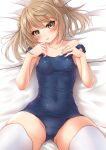  1girl absurdres blue_swimsuit breasts brown_eyes cowboy_shot double_bun highres kantai_collection light_brown_hair looking_at_viewer lying makura_(user_jpmm5733) michishio_(kancolle) pillow school_swimsuit short_twintails small_breasts solo swimsuit thighhighs twintails white_legwear 