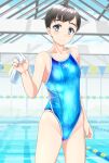 1girl absurdres black_hair blue_eyes blue_swimsuit breasts clothes_writing commentary_request competition_swimsuit cowboy_shot highres indoors lane_line looking_at_viewer one-piece_swimsuit original pool short_hair small_breasts solo standing string_of_flags swim_cap_removed swimsuit takafumi water white_headwear 