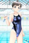  1girl absurdres black_hair black_swimsuit blue_eyes breasts clothes_writing commentary_request competition_swimsuit cowboy_shot highres indoors lane_line looking_at_viewer one-piece_swimsuit original pool short_hair small_breasts solo standing string_of_flags swim_cap_removed swimsuit takafumi two-tone_swimsuit water white_headwear 